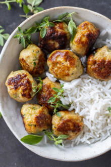 Bowl with rice and Turkey Zucchini Meatballs.