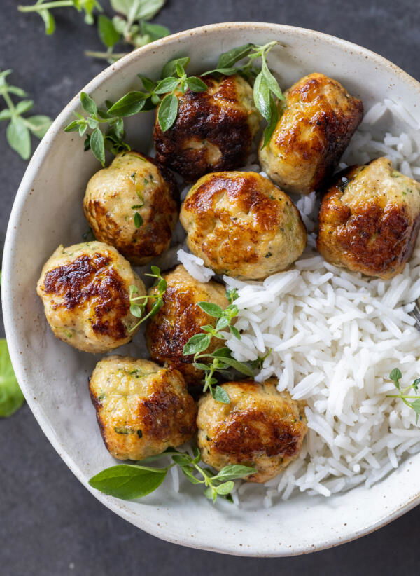 Bowl with rice and Turkey Zucchini Meatballs. 