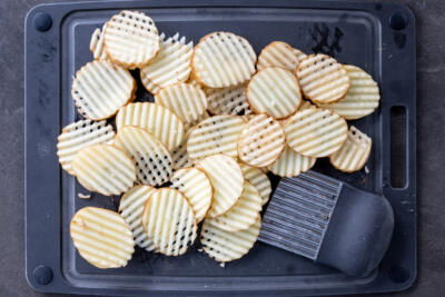 Potato sliced into waffle.