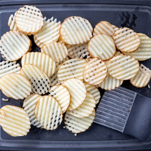 Potato sliced into waffle.
