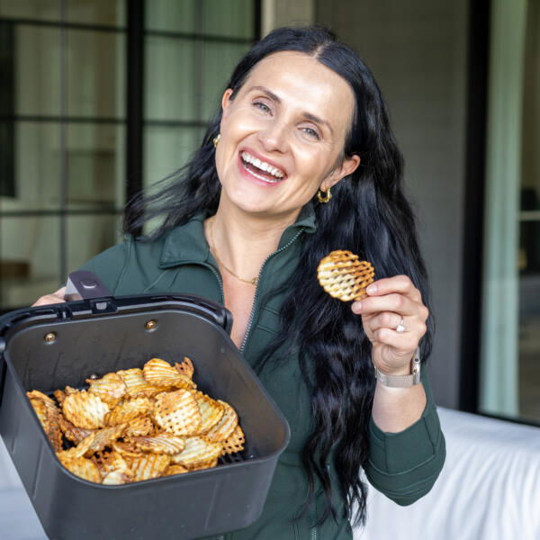 Natalya with air Fryer Waffle Fries in hand.