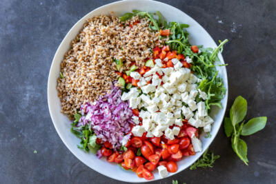 Mediterranean Farro Salad ingredients in a bowl.