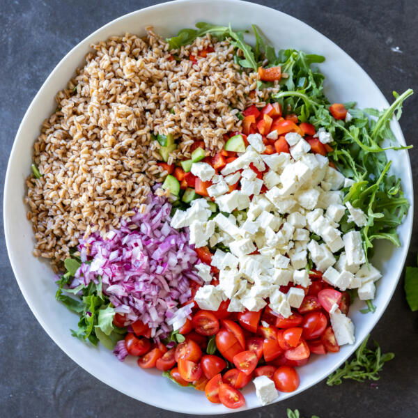 Mediterranean Farro Salad ingredients in a bowl.