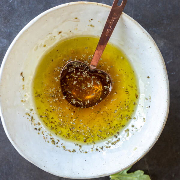 Mediterranean Farro Salad dressing in a bowl.