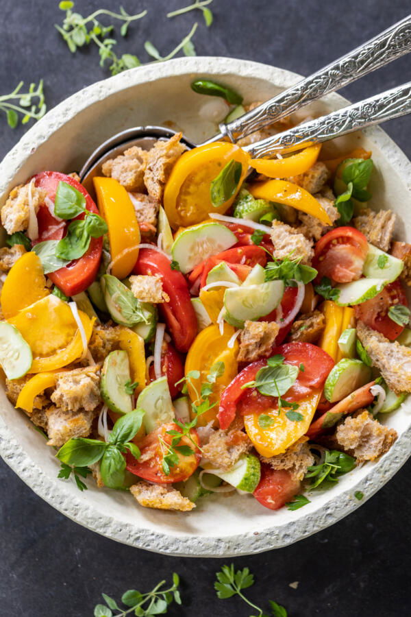 Plated Panzanella Salad with spoons. 