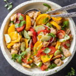 Plated Panzanella Salad with spoons.
