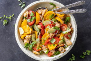 Plated Panzanella Salad with spoons.