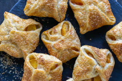 Peach Turnovers on a tray.