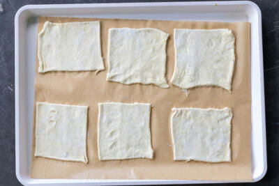 Puff pastry dough sliced into pieces.