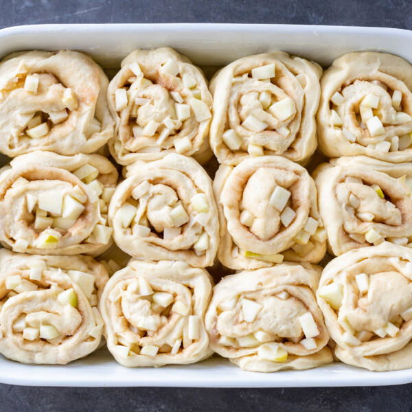 Fluffy Apple Cinnamon Rolls in a baking dish.