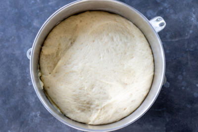 Dough in a mixing bowl that has doubled.
