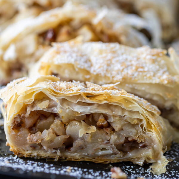 Apple Strudel sliced up on a tray.