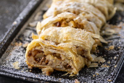 Apple Strudel sliced up on a tray.