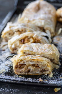 Apple Strudel sliced up on a tray.