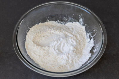 Flour with baking powder in a bowl.