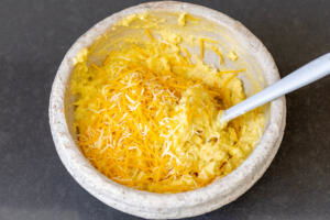 Cheese added to mashed potatoes waffle mixture.