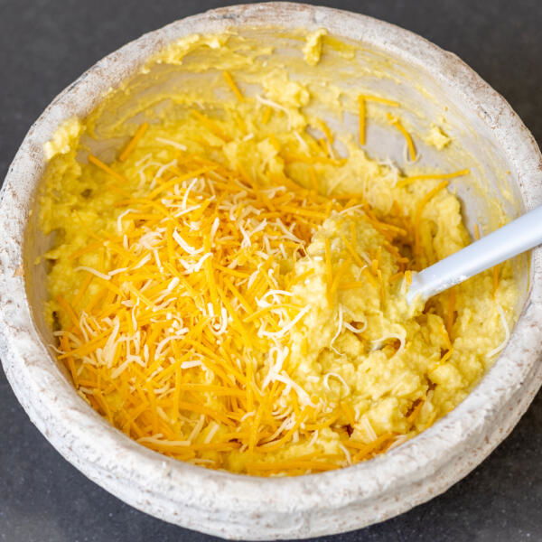 Cheese added to mashed potatoes waffle mixture.