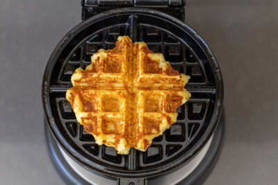 Crispy Mashed Potato Waffles in a waffle maker.