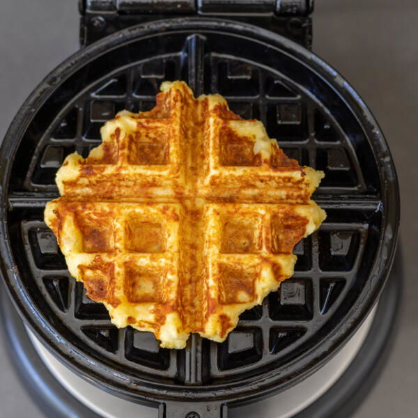 Crispy Mashed Potato Waffles in a waffle maker.