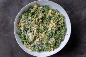 Serving bowl with Kale Pasta Caesar Salad.