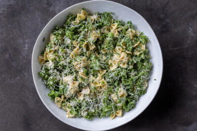 Serving bowl with Kale Pasta Caesar Salad.