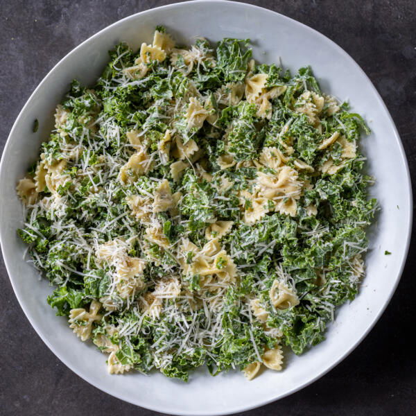 Serving bowl with Kale Pasta Caesar Salad.