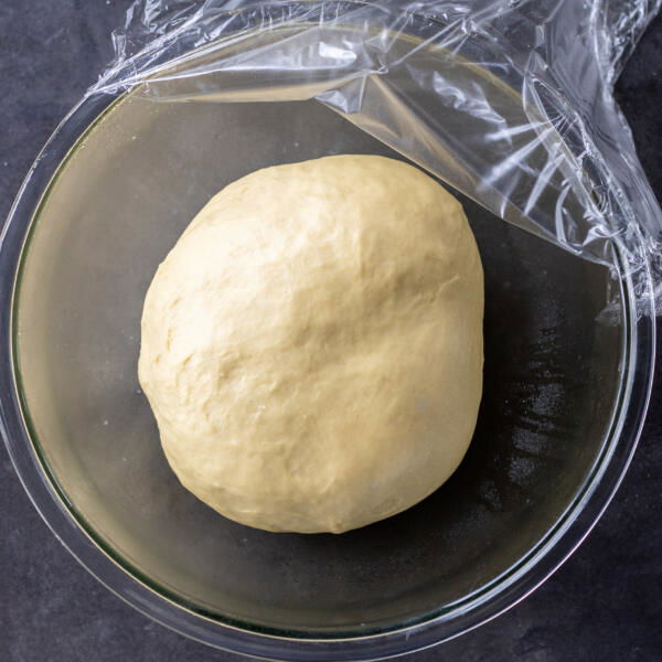 Doubled dough in an oiled bowl.