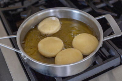 Fried donuts ina pan.
