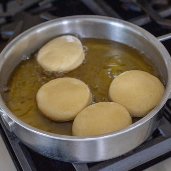 Fried donuts ina pan.
