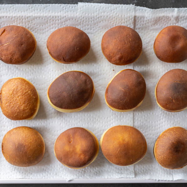 Fried donuts on a paper towel.