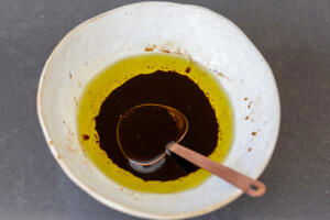 Oil with balsamic vinegar in a bowl.