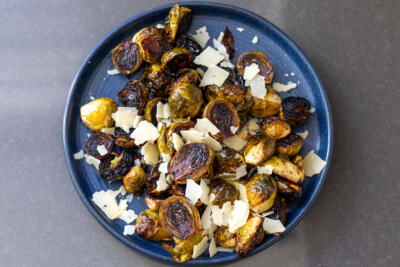 Balsamic Brussels Sprouts on a plate with Parmesan.