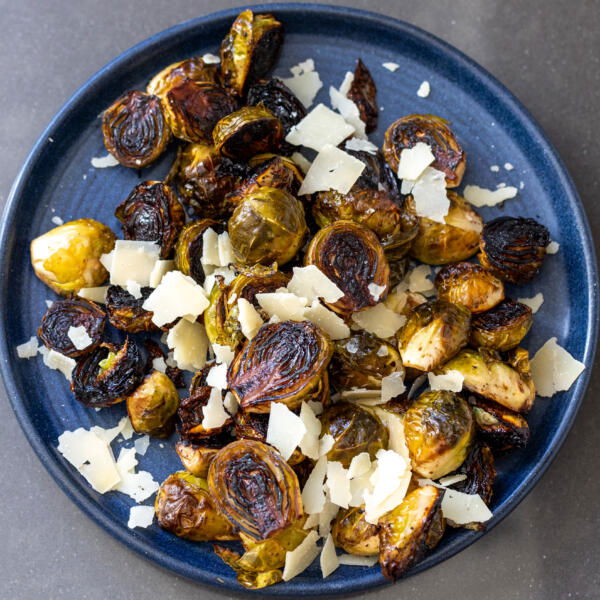 Balsamic Brussels Sprouts on a plate with Parmesan.