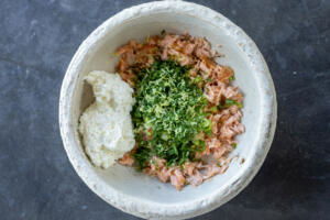 Smoked salmon, herbs and whipped cream cheese in a bowl.