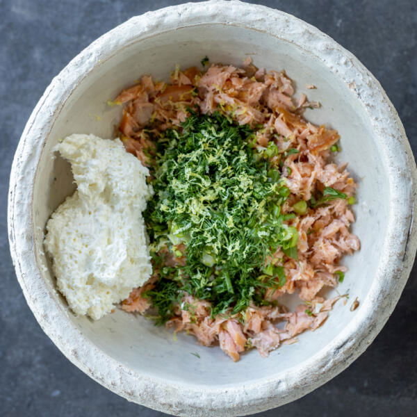 Smoked salmon, herbs and whipped cream cheese in a bowl.