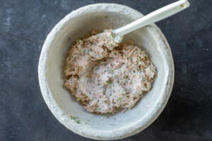 A bowl with all the Smoked Salmon Dip ingredients combined.
