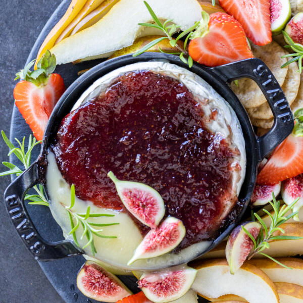 Baked Brie with Jam on a serving tray.