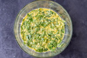 Ingredients all in a bowl for Cottage Cheese Egg Bake.