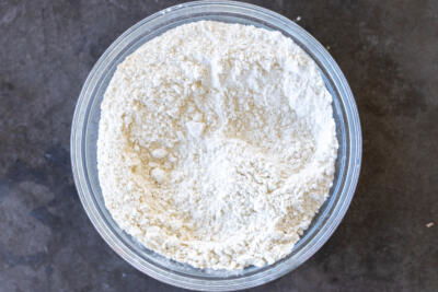Flour, baking soda and baking powder in a bowl.