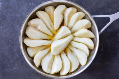 Pears cooking in a pan.