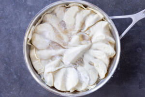 Puff pastry on top of pears.