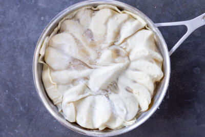 Puff pastry on top of pears.