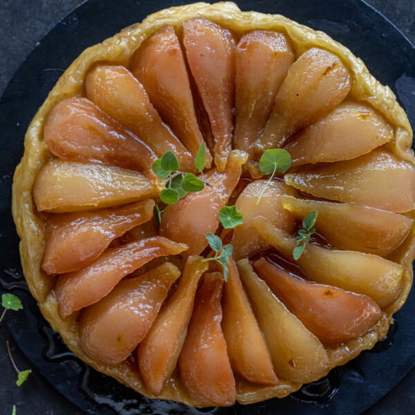 Baked Pear Tarte Tatin on a serving tray.