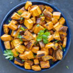 Roasted Cubed Sweet Potatoes in a serving plate.