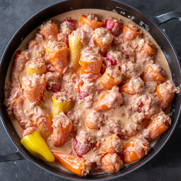 Stuffed Mini Peppers with sauce before cooking.