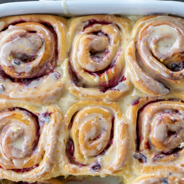 Baking pan Cranberry Cinnamon Rolls with Orange Glaze.