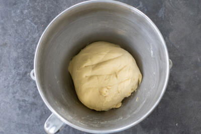 Kneaded dough in a mixing bowl.