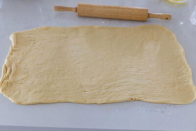 Rolled out dough on a counter.