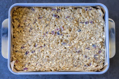Oatmeal Cranberry Bars with Walnuts ingredients in a baking dish.