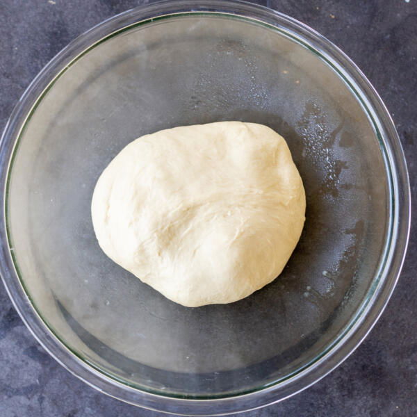 Kneaded babka dough in a bowl.